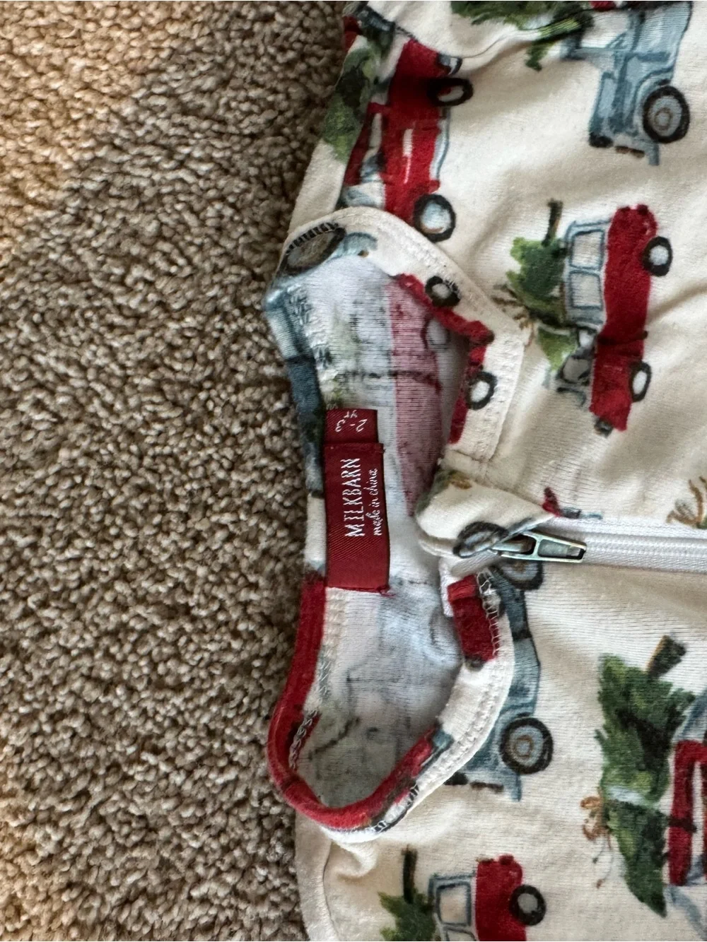 Milkbarn Cream Footed One-Piece with Red and Blue Holiday Truck Print